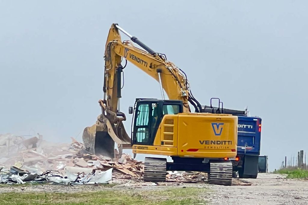excavator doing industrial demolition